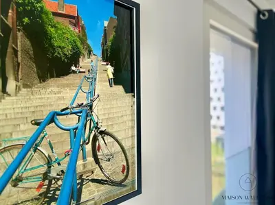 two bikes parked on the side of some stairs at Le studio des Guillemins - Boverie, Gare in Liège