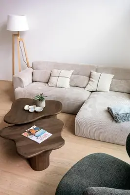 a living room with a couch and a coffee table at Chalet Eau Vive Mase in Maaseik