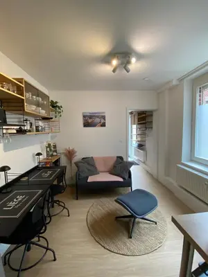 a living room with a piano and a couch at Sweet Home in Liège