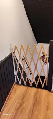 a wooden fence with three sheep in a room at Entre deux Ô à Lixhe,Visé Belgique in Visé