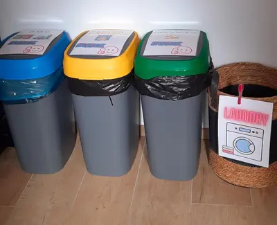 three trash cans are lined up in a room at Entre deux Ô à Lixhe,Visé Belgique in Visé