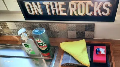 a bathroom counter with a sink and a sign on the rocks at Entre deux Ô à Lixhe,Visé Belgique in Visé