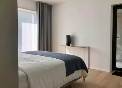 a bedroom with a bed and a window at Huis Vanellus in Hasselt