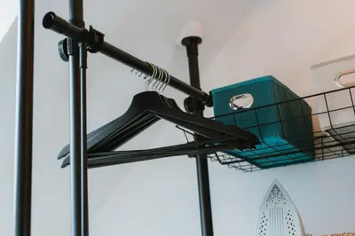 a street light with a shopping basket on it at La Nano Maison de Liège in Liège