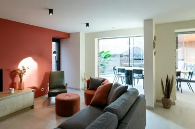 a living room with a couch and a table at Vakantiehuis Remersdaal in Voeren