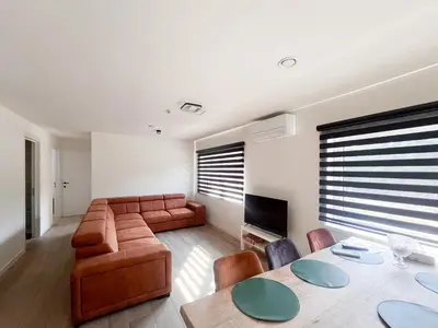 a living room with a couch and a table at Lindehoeve in Heusden - Zolder