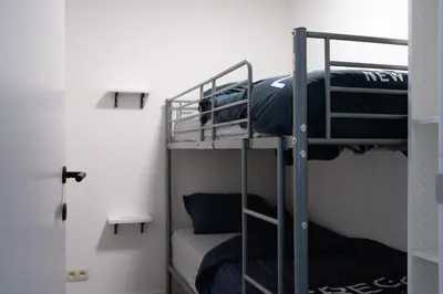 a couple of bunk beds in a room at Lindehoeve in Heusden - Zolder