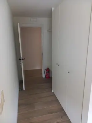 an empty room with a hallway with a door at Lindehoeve in Heusden - Zolder