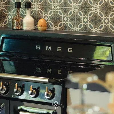 an oven with two eggs sitting on top of it at La Maison de Rose in Riemst
