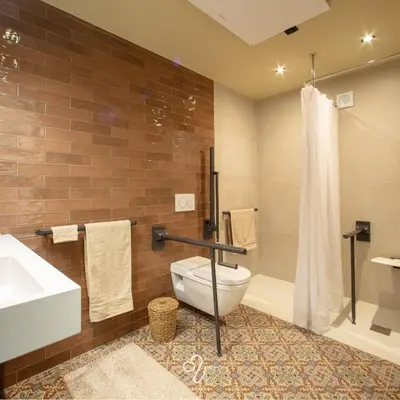 a bathroom with a toilet and a sink and a shower at La Maison de Rose in Riemst