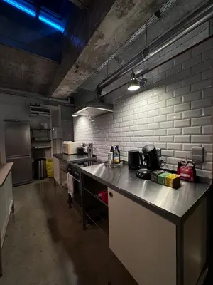 a large kitchen with a counter top in a room at Sleep You Soon - Loft & parking in Liège