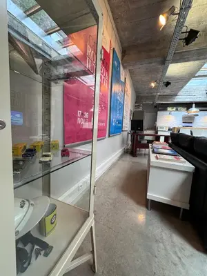 a room with a glass display case in a store at Sleep You Soon - Loft & parking in Liège