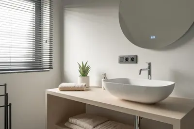 a bathroom with a white sink and a mirror at Vakantie aan de Maas - Vakantiewoning Leenhof in Kinrooi