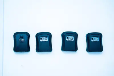a group of four black electronic clocks on a white background at Chambre R2 avec salle de bain partagée près de l'hôpital de la Citadelle à Liège in Liège