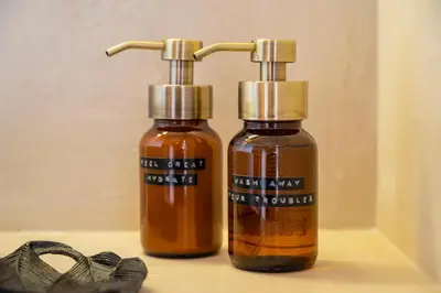 two bottles of essential oils next to a pair of shoes at Stee10 in Lanaken