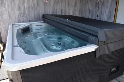 a bath tub sitting inside of a bed at Luxury House in Remersdaal