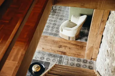 an overhead view of a living room with a white chair at La Petite Maison dans la Prairie in Pepinster