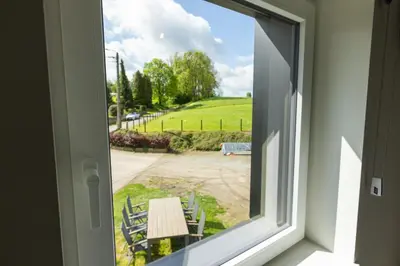 a window view of a picnic table and a park at Vakantiewoning De Ketten in Schoppem