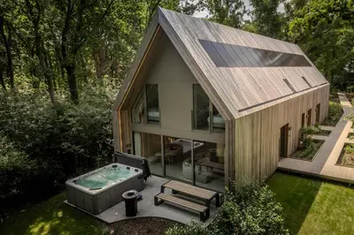 an overhead view of a small house with a hot tub at Lodge met Jacuzzi - 8 personen - Woodz Lodges in Heusden - Zolder