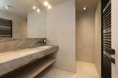 a bathroom with a sink and a mirror at Lodge - 6 personen - Woodz Lodges in Heusden - Zolder