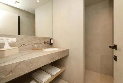 a bathroom with a sink and a mirror at Lodge met Jacuzzi - 6 personen - Woodz Lodges in Heusden - Zolder