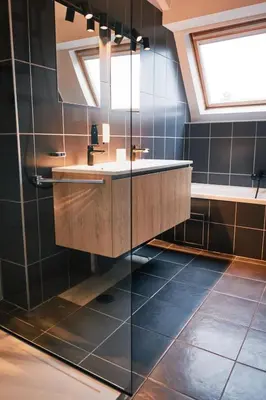 a bathroom with a sink and a mirror at Urbanchic Duplex Adalbert 2A in Liège