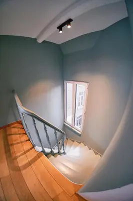 a staircase in a room with a window at Urbanchic Duplex Adalbert 2A in Liège