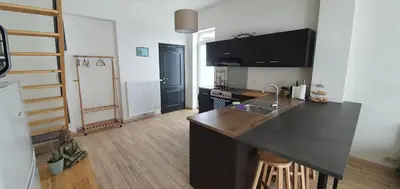 a kitchen with a sink and a counter top at Au 169 La maison du coin in Flémalle-Grande