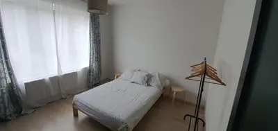 a small bedroom with a bed and a window at Au 169 La maison du coin in Flémalle-Grande