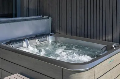 a jacuzzi tub with water in it at Gite Olea de deux personnes in Basse Tribomont