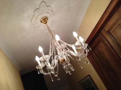 a chandelier is hanging from a ceiling at De Brugdraaier - The Bridge Turner in Neerpelt