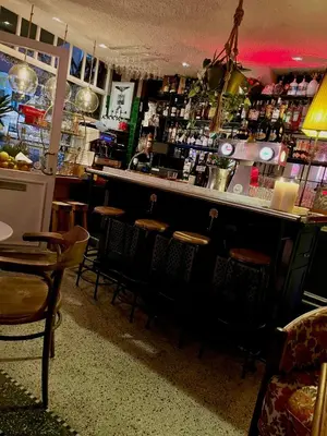 a bar with chairs and a counter in a restaurant at The House Of Jack's in Hasselt