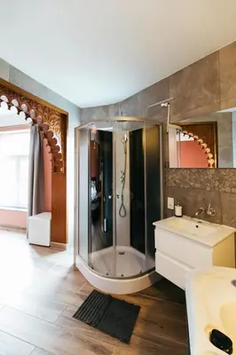a bathroom with a shower and a sink at Hotel Riad Nour in Liège
