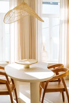 a white table with chairs and a lamp at Sweet Coffee Stay in Hasselt