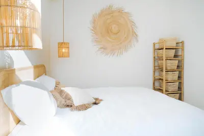 a bedroom with a white bed with two pillows at Sweet Coffee Stay in Hasselt