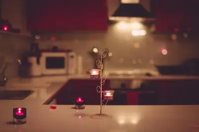 a candle holder sitting on top of a kitchen counter at Studio Le Baiser d'Angeli in Ensival
