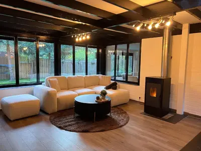 a living room with a couch and a coffee table at Etwee Vakantiehuis in Lanaken