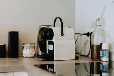 a coffee maker sitting on top of a kitchen counter at 2 bedroom apartment and private parking in Liège center in Liège