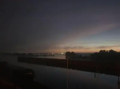 a view of a body of water at sunset at Waterside Zen - Maastricht in Visé