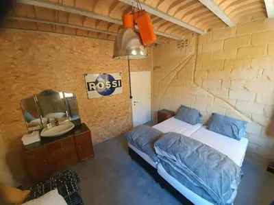 a bedroom with a bed and a sink at Waterside Zen - Maastricht in Visé