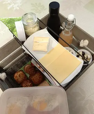 a drawer filled with food and other items in a refrigerator at Hoeve Hofgaarde in Heers