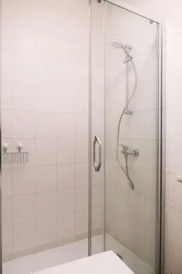 a shower with a glass door in a bathroom at 1 bedroom apartment in Liège center - 3rd floor in Liège