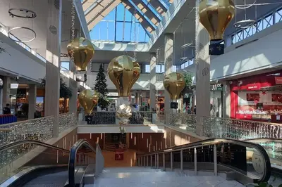 a large shopping mall with gold decorations on the ceilings at Angleur Appartement 001 rez arrière in Liège