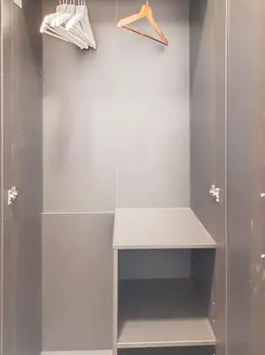 a walkin closet with a shower and a shelf at Angleur Appartement 001 rez arrière in Liège