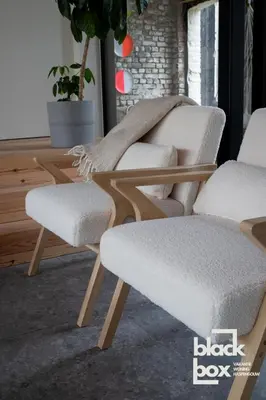 two white chairs sitting next to each other in a room at Black Box by De Schrijfbar - vakantiewoning Haspengouw in Wellen