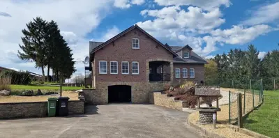 a large brick house with a driveway at Eaglenest in Baelen