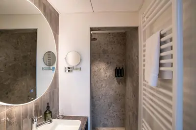 a bathroom with a sink and a mirror at Boutique Hotel Annamaes, Maastricht-Hoge Kempen in Lanaken