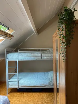 a bedroom with two bunk beds in a attic at Hengelhoef Ceder 106 in Houthalen-Helchteren