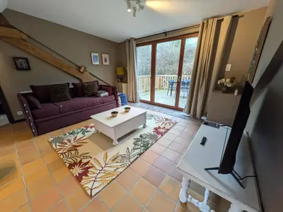 a living room with a couch and a table at L'Air du Pré by WelcHome in Verviers