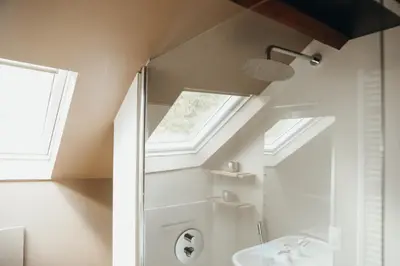 a bathroom with a shower and a sink and a window at L'Air du Pré by WelcHome in Verviers